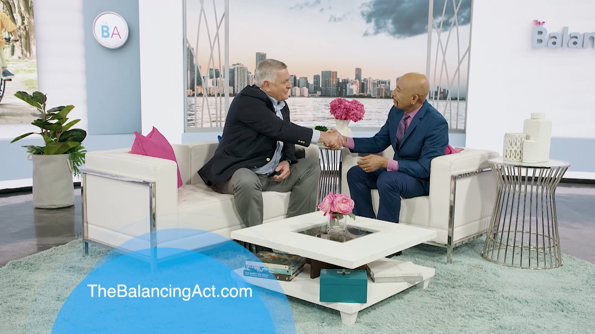 my529 Executive Director Richard Ellis shakes hands with Montel Williams on the set of The Balancing Act. 