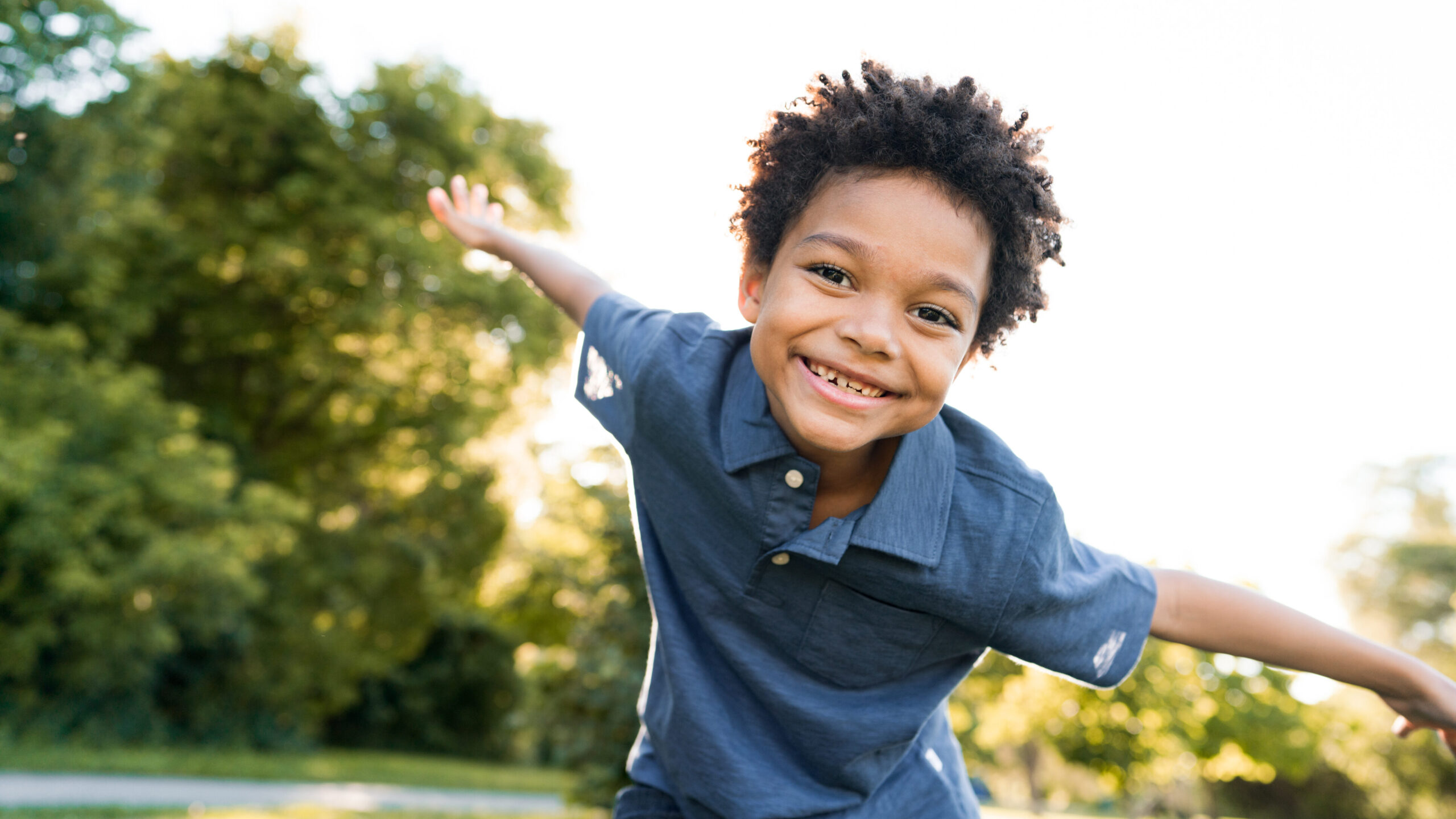 A kid enjoys a day in the park.